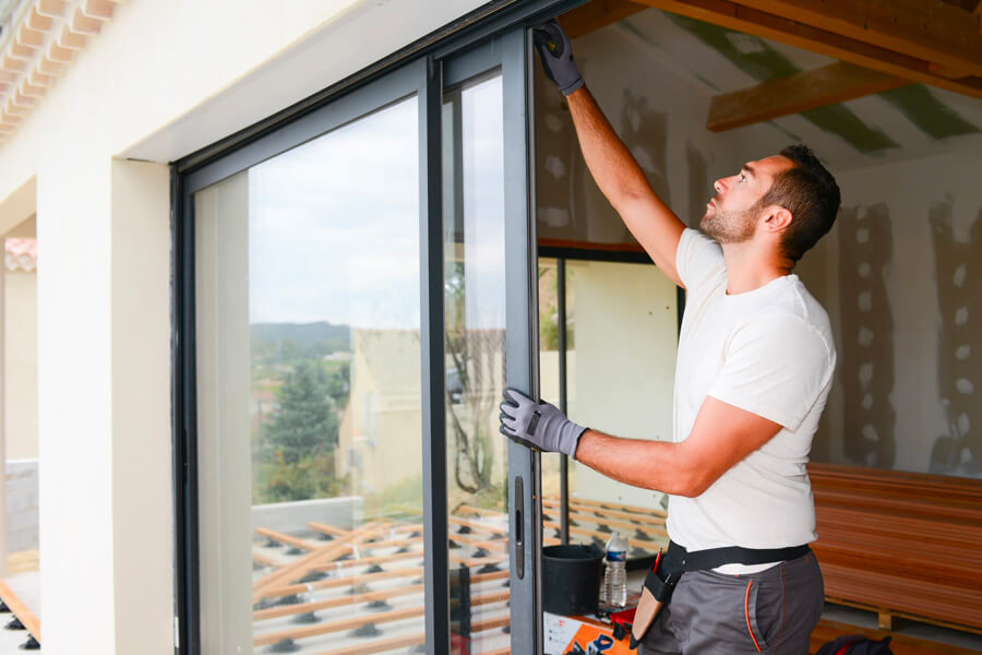 sliding patio door being installed